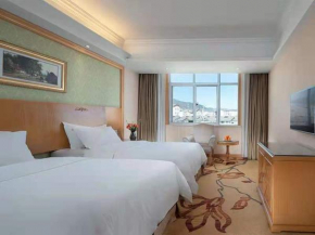 Отель Vienna International Hotel Lijiang Yuxue Avenue  Лицзян